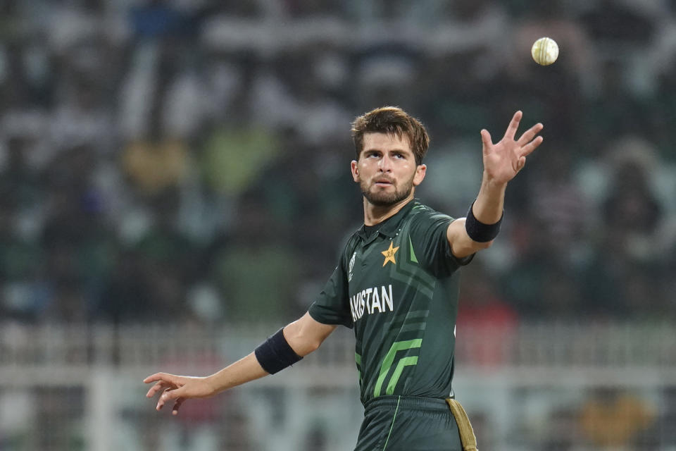 Pakistan's Shaheen Afridi collects the ball as he prepares to bowl a delivery during the ICC Men's Cricket World Cup match between Bangladesh and Pakistan in Kolkata, India, Tuesday, Oct. 31, 2023. (AP Photo/Aijaz Rahi)
