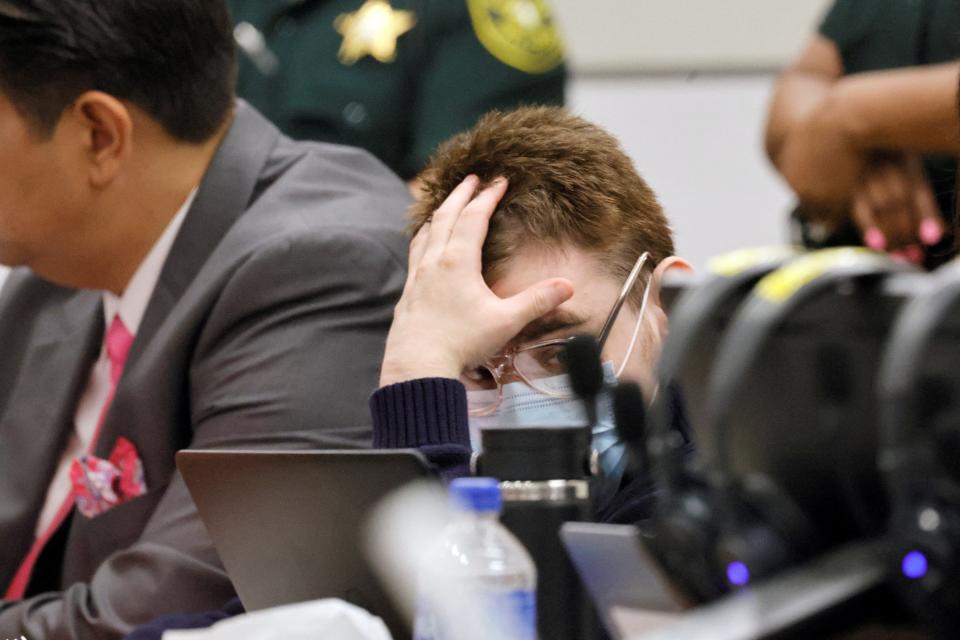 Nikolas Cruz sat with his head in his hands during some of the session (REUTERS)