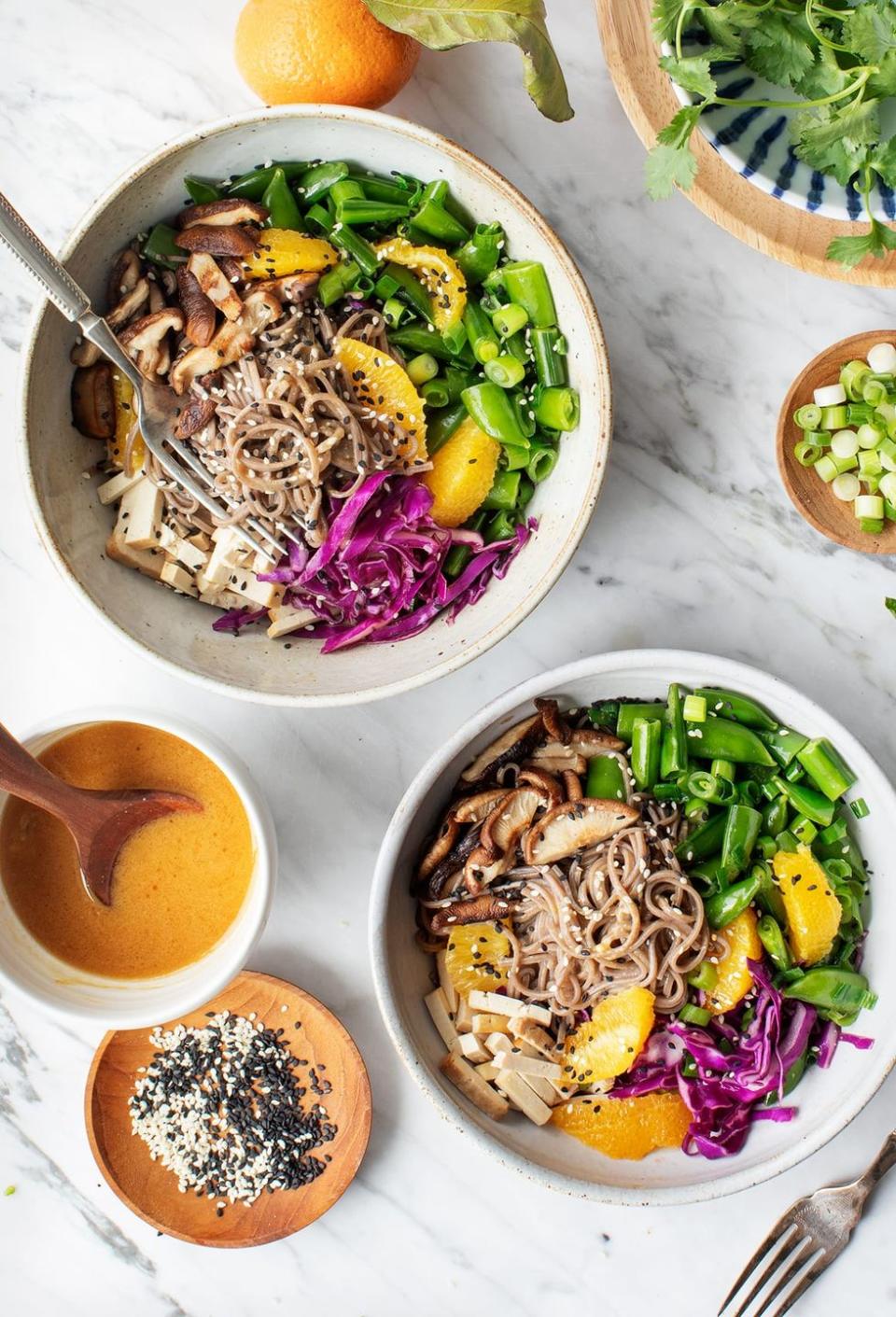<p>Soy sauce and mushrooms are a match made in umami heaven, while even more fresh elements make this refreshing lunch bowl a flavor powerhouse.</p><p><em><em><a href="https://www.loveandlemons.com/sesame-orange-noodle-bowl/" rel="nofollow noopener" target="_blank" data-ylk="slk:Get the recipe from Love and Lemons »;elm:context_link;itc:0;sec:content-canvas" class="link ">Get the recipe from Love and Lemons »</a></em></em> </p>