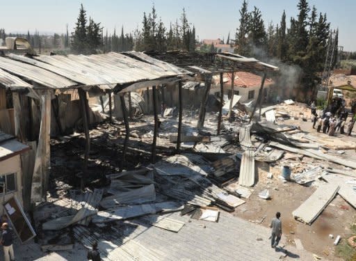 Picture released by the Syrian news agency SANA shows the Al-Ikhbariya satellite television channel's offices shortly after it was attacked on June 27. Twin bombs exploded outside the Palace of Justice in Damascus on Thursday as deadly violence raged across the country and Turkey reinforced its volatile border with Syria with missile batteries