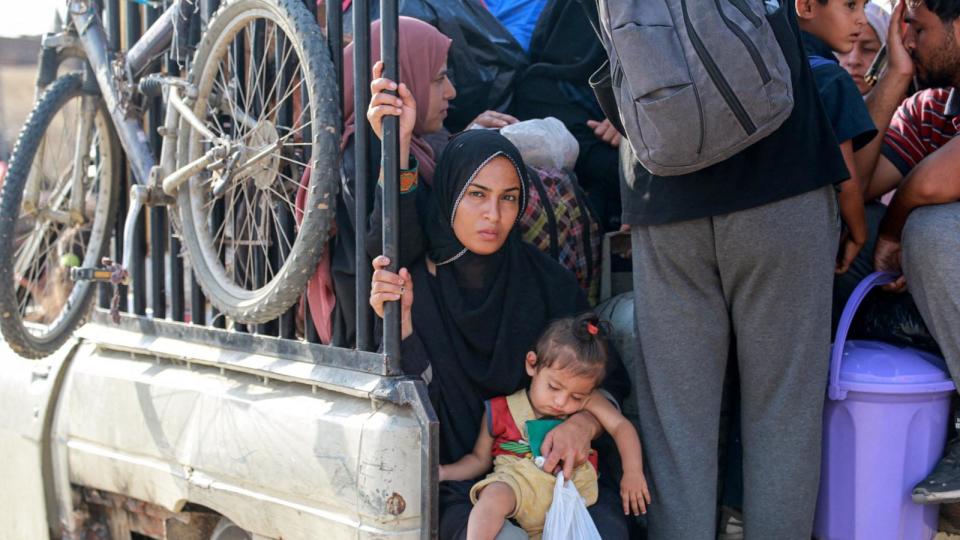 PHOTO: Palestinians ride in the back of a pickup truck in a displacement area the al-Mawasi area in Khan Yunis in the southern Gaza Strip, June 20, 2024. (Bashar Taleb/AFP via Getty Images)