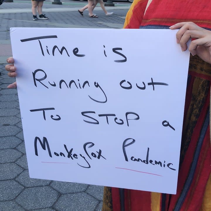 Protestor sign reading, 