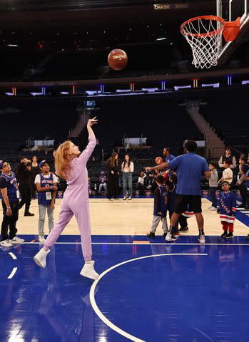 <p>Jamie McCarthy/Getty Images for Baby2Baby</p> Jessica Chastain plays basketball while hosting Baby2Baby's Back2School celebration at NYC's Madison Square Garden on Oct. 14, 2023