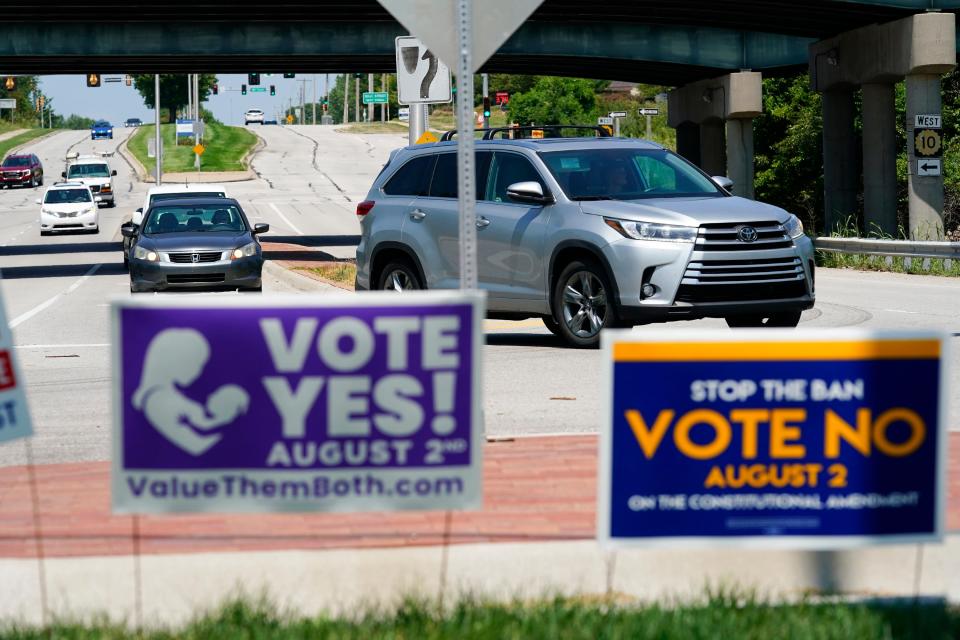 OVERLAND PARK, KANSAS - AUGUST 01: Signs in favor and against the Kansas Constitutional Amendment On Abortion are displayed outside Kansas 10 Highway on August 01, 2022 in Lenexa, Kansas. On August 2, voters will vote on whether or not to remove protection for abortion from the state constitution. (Photo by Kyle Rivas/Getty Images) ***BESTPIX*** ORG XMIT: 775851392 ORIG FILE ID: 1412308440