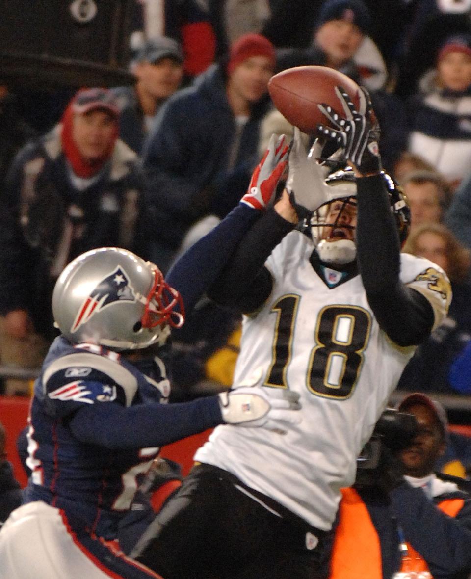 Jaguars wide receiver Matt Jones (18) is unable to hold a David Garrard pass in the end zone in the fourth quarter as Patriots cornerback Randall Gay (21) defends, during the 2007-08 AFC divisional playoffs.