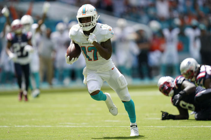Miami Dolphins wide receiver Jaylen Waddle (17) runs for a touchdown during the first half of an NFL football game against the New England Patriots, Sunday, Sept. 11, 2022, in Miami Gardens, Fla. (AP Photo/Lynne Sladky)