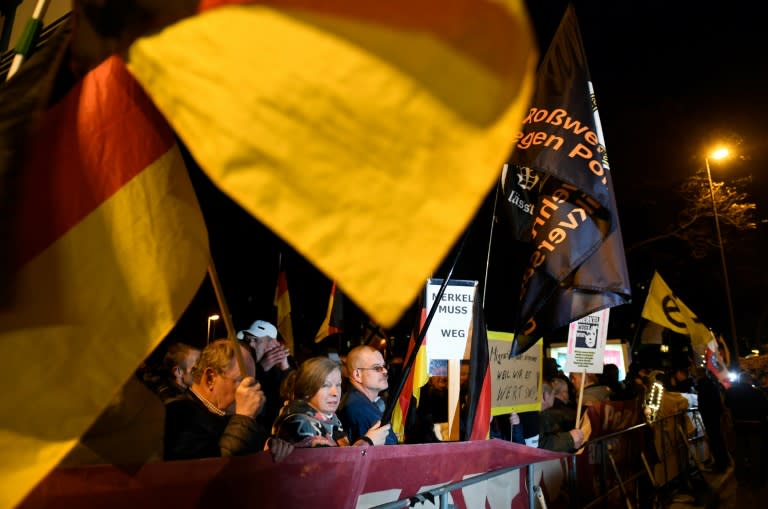 Far-right protesters also marched during the Merkel visit, with placards bearing slogans such as "Merkel has to go"