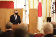 IOC President Thomas Bach, center, speaks during a welcome party for Bach and IOC officials at Akasaka Palace, Japanese state guest house, in Tokyo, Japan, Sunday, July 18, 2021.(Courtesy of Tokyo 2020 via AP)