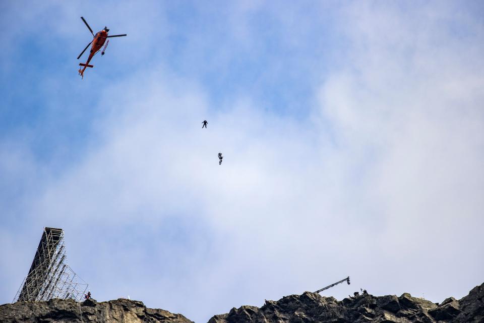 Tom Cruise comes off a motorbike during the filming of the next Mission Impossible film in Hellesylt, Norway. (NTB Scanpix/AFP via Getty Images)