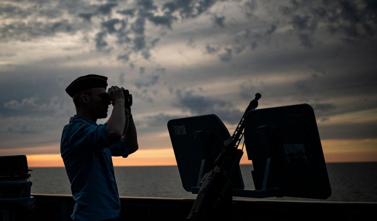 <span class="caption">Finland and Sweden joined 14 NATO allies in a June 6, 2022, military exercise on the Baltic Sea. </span> <span class="attribution"><a class="link " href="https://www.gettyimages.com/detail/news-photo/german-navy-sailor-uses-the-binoculars-onboard-the-german-news-photo/1241200558?adppopup=true" rel="nofollow noopener" target="_blank" data-ylk="slk:Jonathan Nackstrand/AFP via Getty Images;elm:context_link;itc:0;sec:content-canvas">Jonathan Nackstrand/AFP via Getty Images</a></span>