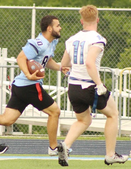 Caleb Perry, left, bolts to the end zone during Bartlesville High alumni game on May 25, 2023, at Custer Stadium. This was Custer's first competitive football action in nearly three years.