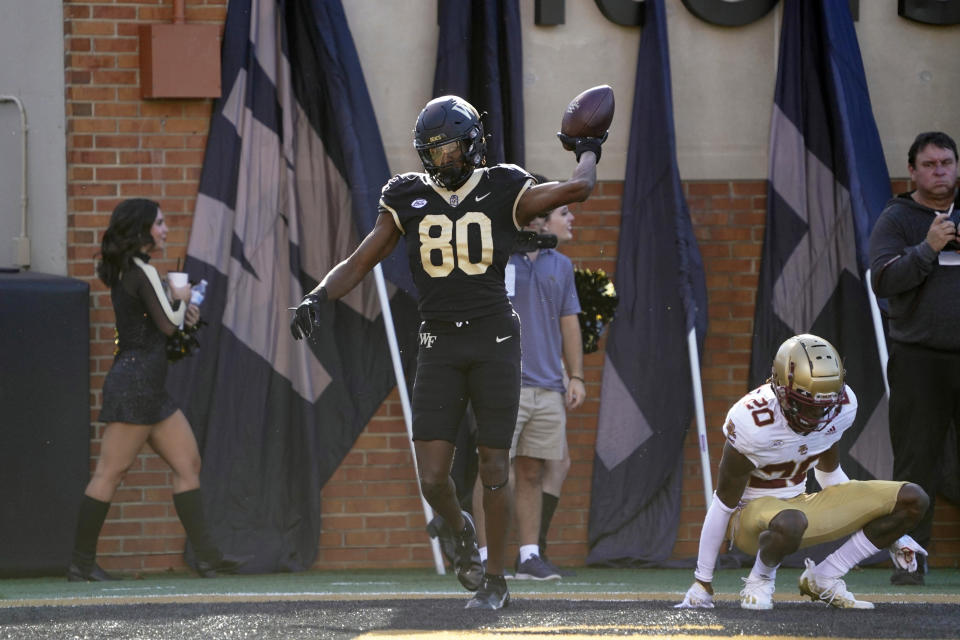 FILE - Wake Forest wide receiver Jahmal Banks (80) celebrates his touchdown catch against Boston College during the first half of an NCAA college football game in Winston-Salem, N.C., Oct. 22, 2022. Wake Forest opens the season against Elon on Aug. 31, 2023. (AP Photo/Chuck Burton, File)