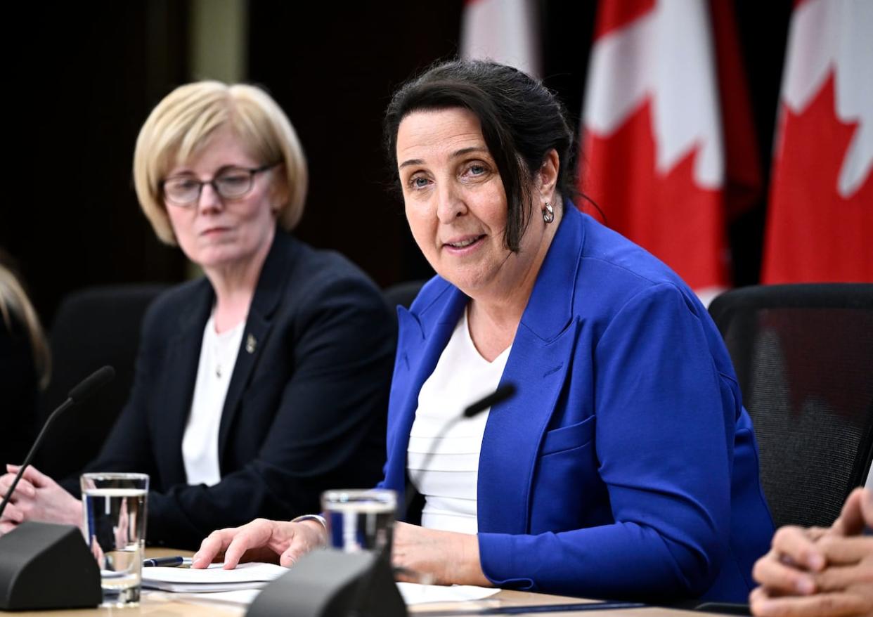 Justice Lise Maisonneuve, who will lead the Future of Sport in Canada Commission, participates in a news conference with Minister of Sport and Physical Activity Carla Qualtrough in Ottawa on Thursday, May 9, 2024. (Justin Tang/The Canadian Press - image credit)