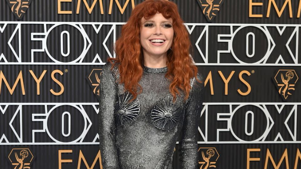 Natasha Lyonne looked like a futuristic Joan de Arc in a striking metallic Schiaparelli mermaid gown and fiery copper curls. - Richard Shotwell/Invision/AP