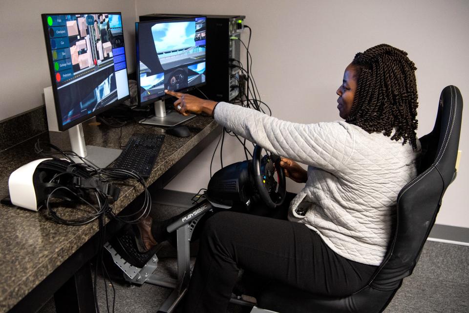Autism Breakthrough of Knoxville executive director Kendrise Colebrook demonstrates a driving simulator offered at Autism Breakthrough's office on Tuesday, Nov. 22, 2022. The nonprofit offers a variety of support services to help adults with autism lead purposeful lives.