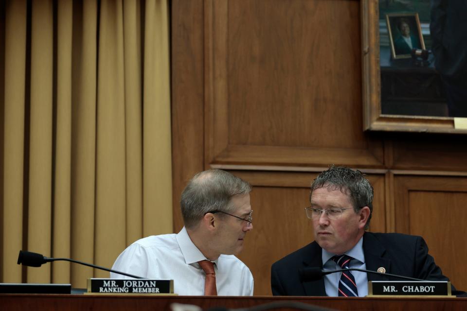 Ranking Member Jim Jordan (R-OH) (L) speaks with Rep. Thomas Massie (R-KY) (R) during a House Judiciary Committee hearing on gun-control bills in the Rayburn House Office Building on June 02, 2022 in Washington, DC.