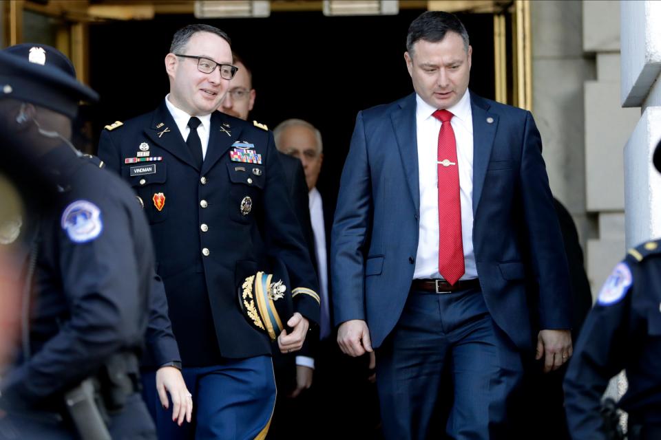 Army Lt. Col. Alexander Vindman, left, and his twin brother, Lt. Col. Yevgeny Vindman, on Capitol Hill on Nov. 19, 2019.