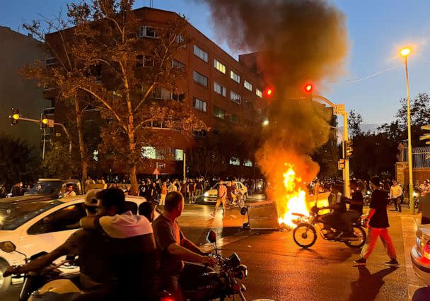 PHOTO: A police motorcycle burns during a protest over the death of Mahsa Amini, a woman who died after being arrested by the Islamic republic's 'morality police', in Tehran, Iran Sept. 19, 2022. (Wana News Agency/via Reuters, FILE)