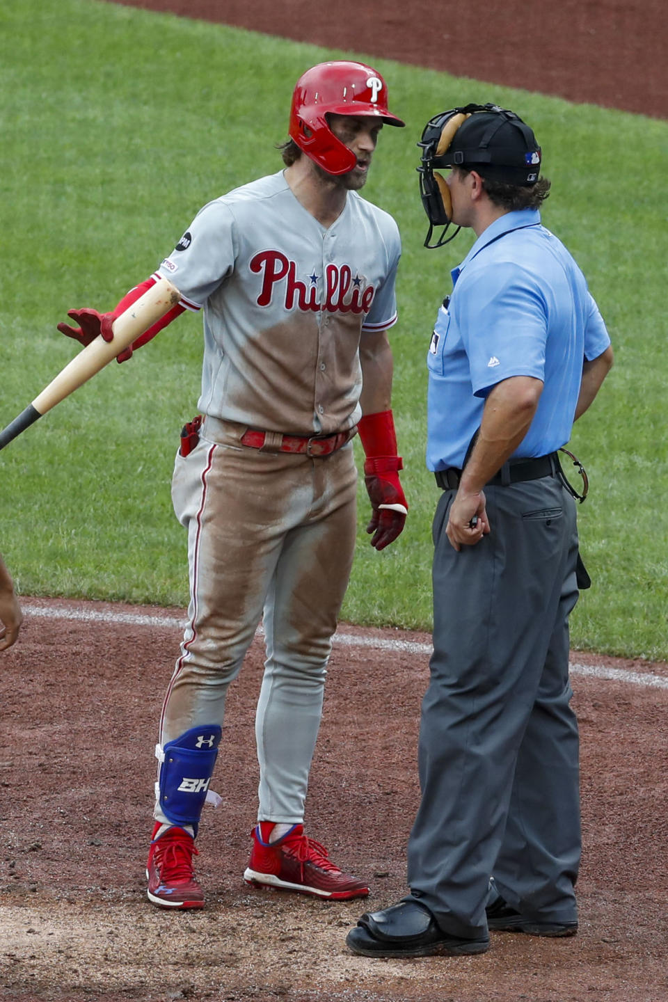 Philadelphia Phillies' Bryce Harper, left, argues a called third strike with home plate umpire Brian May in the sixth of a baseball game against the Pittsburgh Pirates, Sunday, July 21, 2019, in Pittsburgh. (AP Photo/Keith Srakocic)