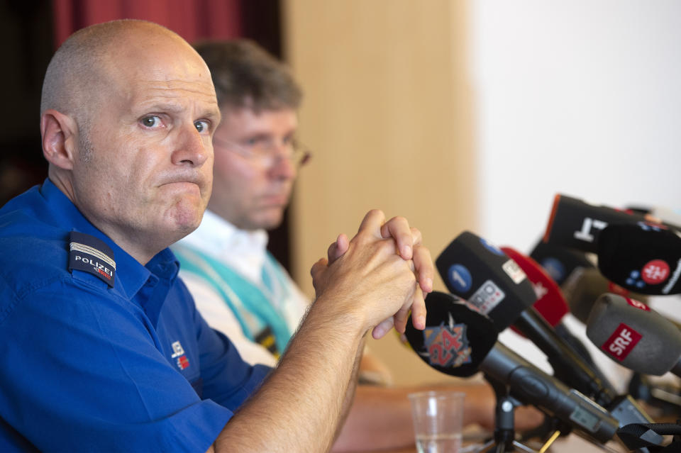 Andreas Tobler, head of operations of the cantonal police of Grisons addresses the media during a press conference in Flims, Switzerland, Sunday, Aug. 5, 2018 about the plane crash on Saturday afternoon. The plane, a Junkers Ju-52, crashed on Saturday, Aug. 4, 2018 at the Piz Segnas, all 20 people aboard died. (Melanie Duchene/Keystone via AP)