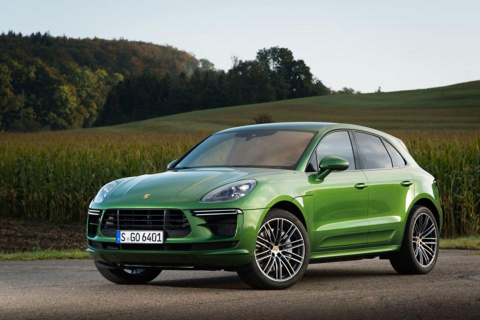 <p>The Macan Turbo receives subtle exterior enhancements, including a revised front fascia, side skirts, and a model-specific rear spoiler</p>