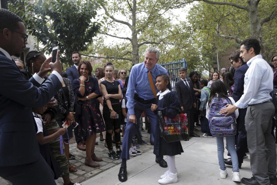 <span class="caption">New York City Mayor Bill De Blasio, New York City School’s Chancellor Richard Carranza and others greet students as they exit their first day of school Setp. 5, 2019. Carranza and De Blasio have said closing schools is a last resort. Mpi43/MediaPunch/IPX.</span> <span class="attribution"><a class="link " href="http://www.apimages.com/metadata/Index/Mayor-Bill-De-Blasio-visits-NYC-Schools/512dbdb7036b41ff9f3ce8d1ca754982/66/0" rel="nofollow noopener" target="_blank" data-ylk="slk:AP Photo/Mpi43/MediaPunch /IPX;elm:context_link;itc:0;sec:content-canvas">AP Photo/Mpi43/MediaPunch /IPX</a></span>