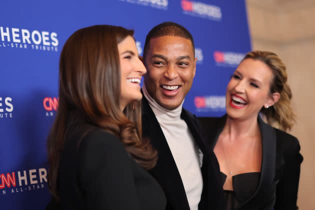 Don Lemon (center) poses with 