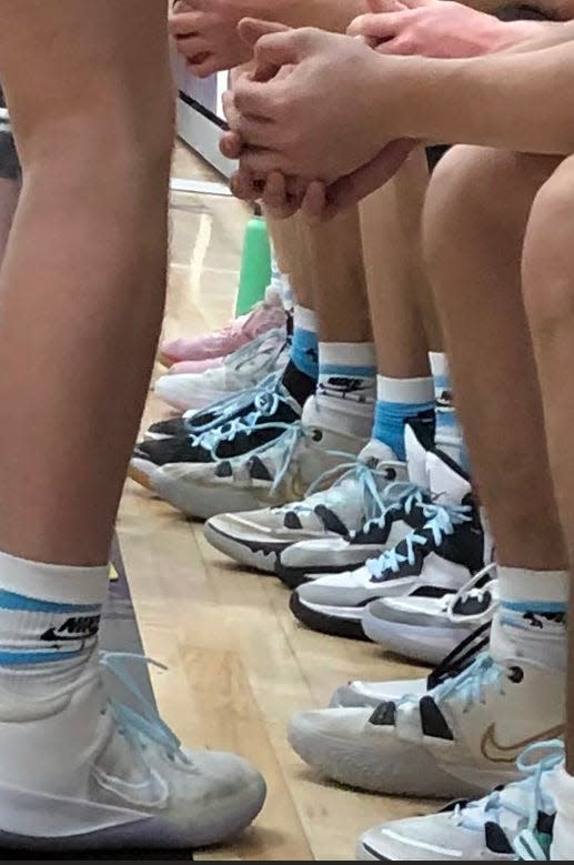 The St Ignace Saints, in a show of support for head coach Doug Ingalls laced up with blue laces and blue striped socks for their game against Pickford on Tuesday night.
