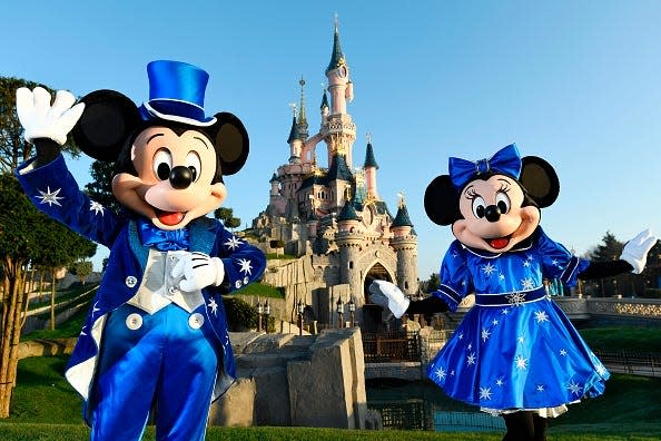 Disney characters Mickey and Minnie Mouse pose in front of the Sleeping Beauty Castle to mark the 25th anniversary of Disneyland - originally Euro Disney Resort - on March 16, 2017 in Marne-La-Vallee, east of the French capital Paris.
The 25th anniversary celebrations will begin on March 26, 2017 with parades, various shows and a firework's display. / AFP PHOTO / BERTRAND GUAY        (Photo credit should read BERTRAND GUAY/AFP/Getty Images)