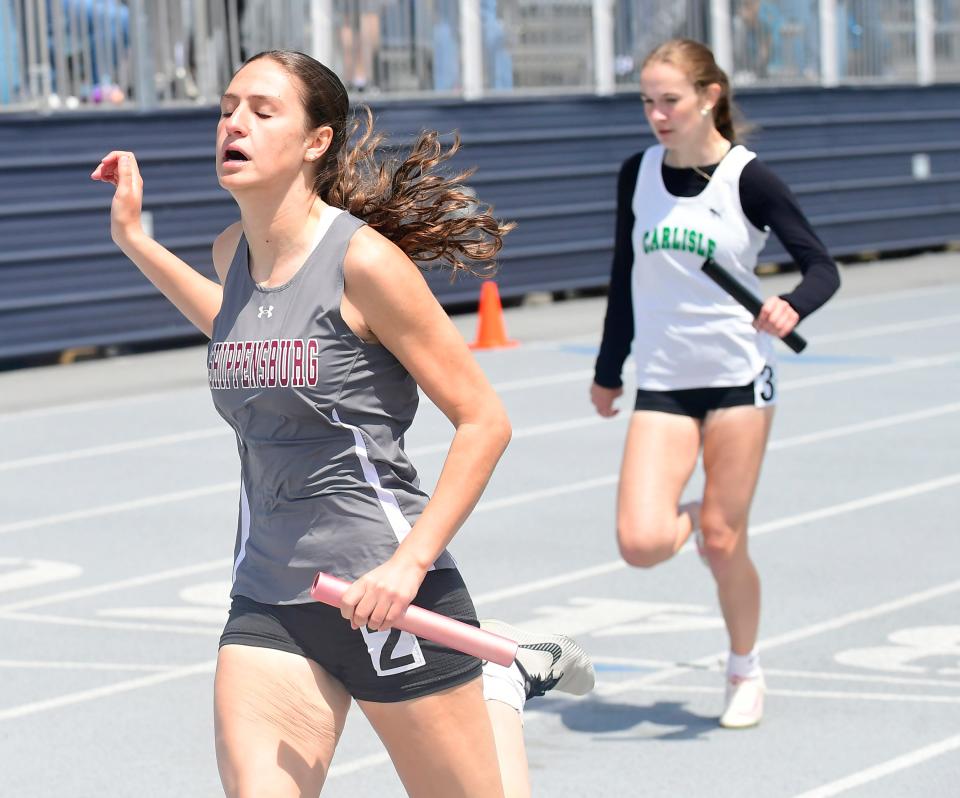 Shippensburg's Anna Massara brings in the anchor leg in the 4x100 race. Athletes competed in the Mid-Penn Conference track and field championships on Saturday, May 11, 2024 at Chambersburg's Trojan Stadium.