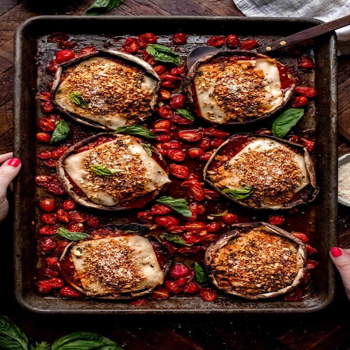 Mushroom parmesan over roasted cherry tomatoes.