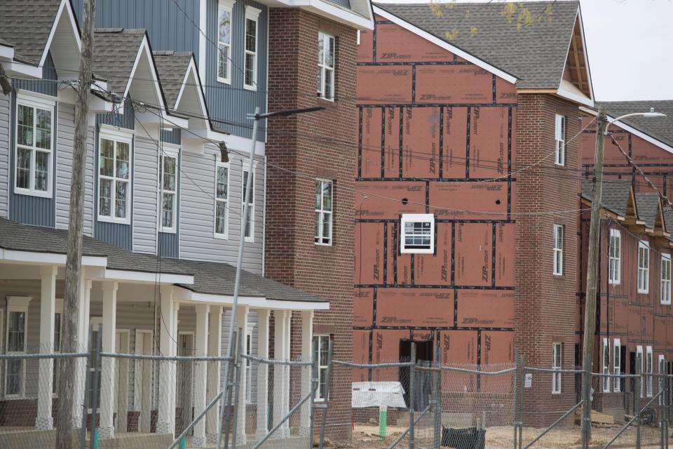 Construction continues on new affordable housing as part of the Reach Riverside improvements to the neighborhood Monday, April 25, 2022.  