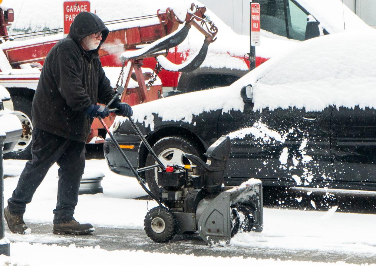 Chris Howell, from Morrisville, clears snow with a snowblower along W. Bridge St. after Monday night’s snowstorm in Morrisville on Tuesday, Jan. 16, 2024. Daniella Heminghaus | Bucks County Courier Times