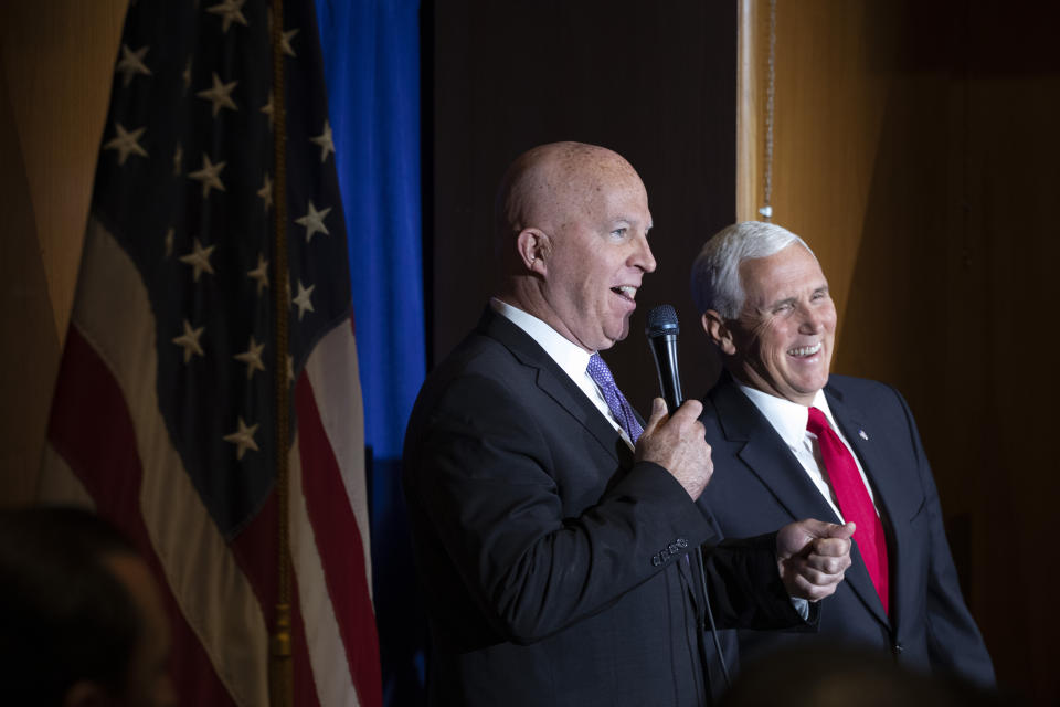 New York Police Commissioner James O'Neill, left, introduces Vice President Mike Pence during a visit with the NYPD's football team, Thursday, Sept. 19, 2019. Pence met earlier with the NYPD for a counterterrorism briefing. (AP Photo/Mark Lennihan)