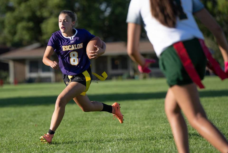 Escalon’s Hannah Wampler runs the ball in for a touchdown during the game with Tracy at Escalon High School in Escalon, Calif., Wednesday, Sept. 13, 2023.