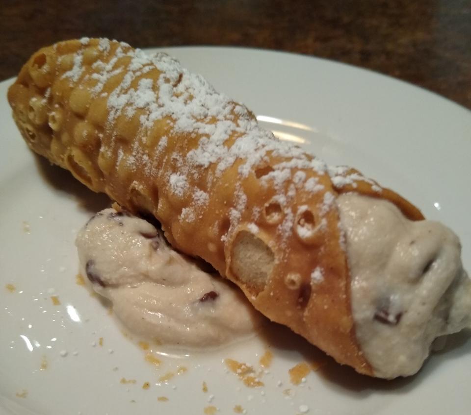 A homemade cannoli is served at Casa D’Angelo in Macedonia. Instead of splitting one, why not order two?