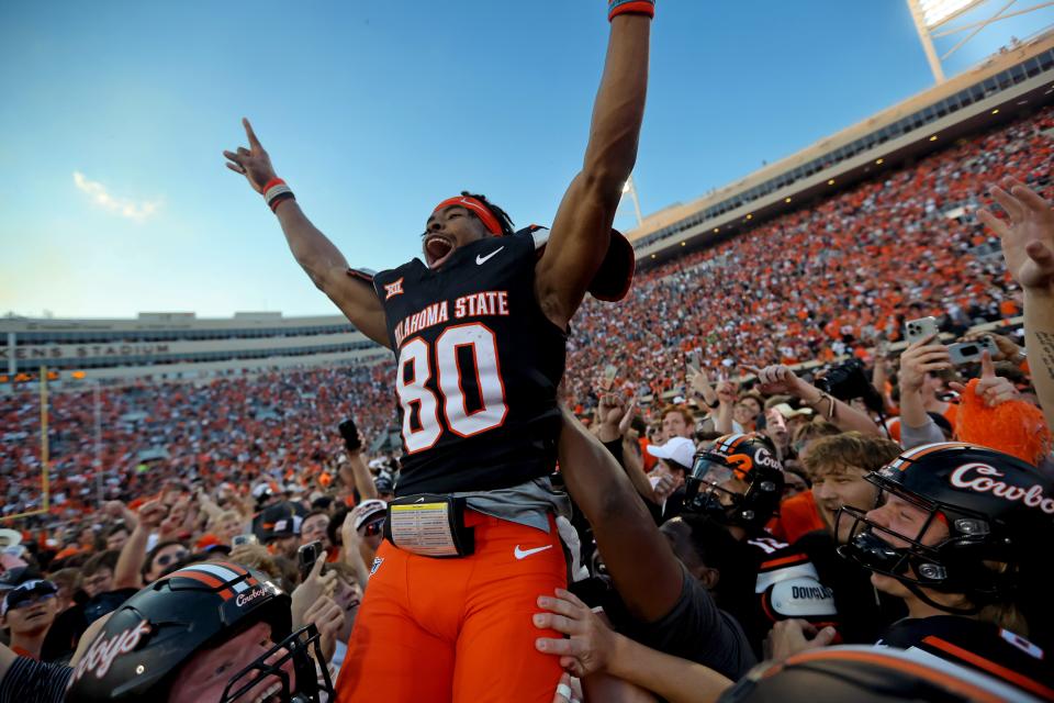 Oklahoma State's Brennan Presley (80) celebrates with teammates following a Bedlam college football game between the Oklahoma State University Cowboys (OSU) and the University of Oklahoma Sooners (OU) at Boone Pickens Stadium in Stillwater, Okla., Saturday, Nov. 4, 2023.