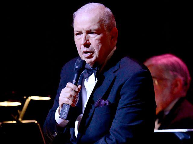 <p>Johnny Louis/Getty</p> Frank Sinatra Jr. performs during the Jazz Roots: Frank Sinatra Jr. Sings Sinatra, a Multimedia Centennial Celebration on March 11, 2016 in Miami, Florida.