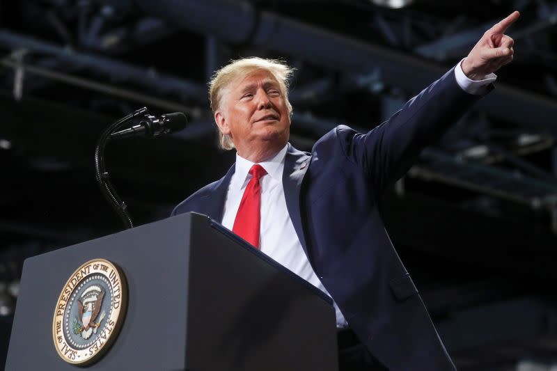 U.S. President Donald Trump reacts while speaking during a campaign rally in Battle Creek, Michigan