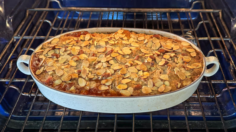 Baked almond-rhubarb dump cake in oven