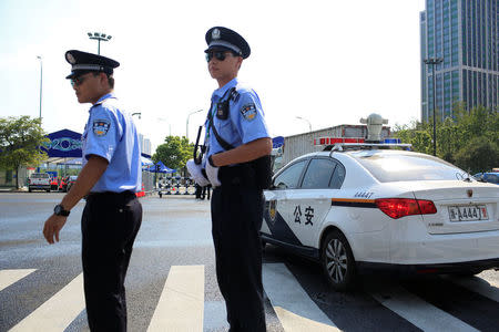 Police patrol in front of the entrance of a conference centre, where the G20 summit will be held, in Hangzhou, Zhejiang Province, China August 31, 2016. REUTERS/Aly Song