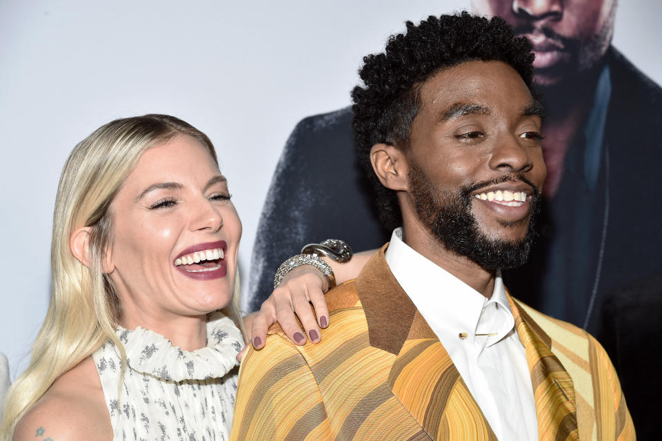 NEW YORK, NEW YORK - NOVEMBER 19: Sienna Miller and Chadwick Boseman attend "21 Bridges" New York Screening at AMC Lincoln Square Theater on November 19, 2019 in New York City. (Photo by Steven Ferdman/WireImage)