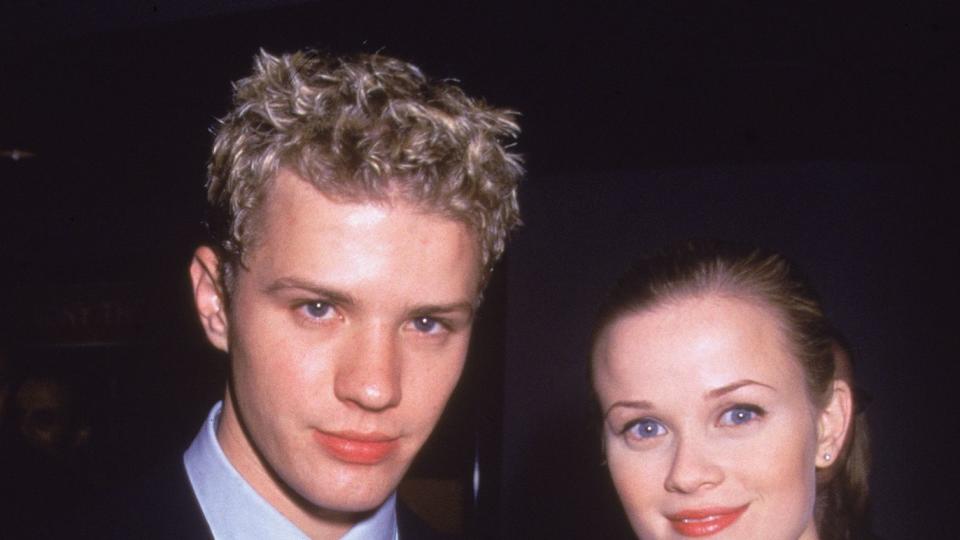 Reese Witherspoon smiles with her fiancee, American actor Ryan Phillippe as they attend an event, New York City, circa 1998. They later married in 1999.