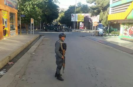 An Afghan policeman stands guard near the site of an attack in Kabul, Afghanistan September 6, 2016. REUTERS/Mohammad Ismail