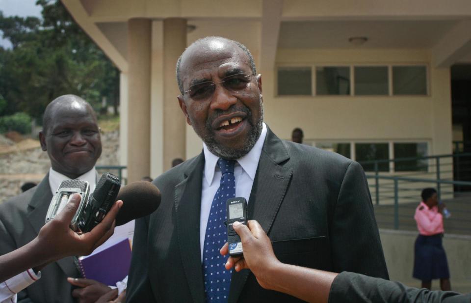 In this photo taken Tuesday, Feb. 25, 2014, Uganda's health minister, Ruhakana Rugunda, speaks to the media outside Mulago Hospital, Uganda’s national referral hospital, in Kampala, Uganda. Uganda's health minister said Wednesday that gays will not be discriminated against by medical workers after the country's president signed a law that strengthens criminal penalties against homosexuals, but prominent gay rights activist Pepe Julian Onziema said that well-known homosexuals face constant discrimination and abuse and recalled being ignored many times by medical workers who served others as they gossiped about his sexual orientation. (AP Photo)