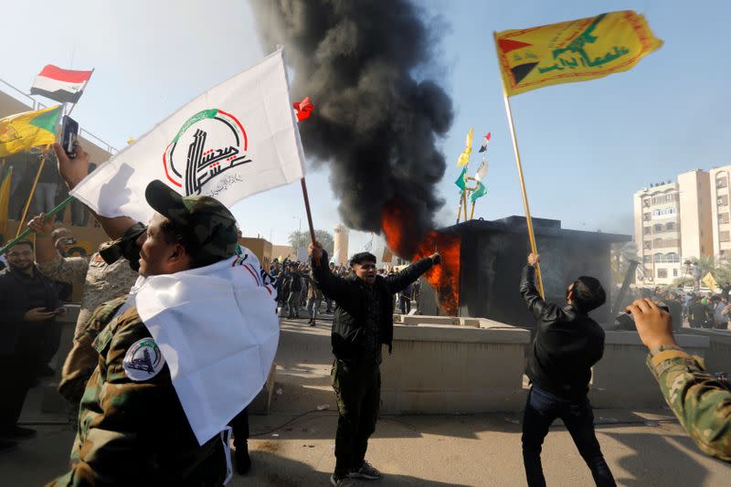 Protesters and militia fighters set on fire a security building of the U.S. Embassy in Baghdad