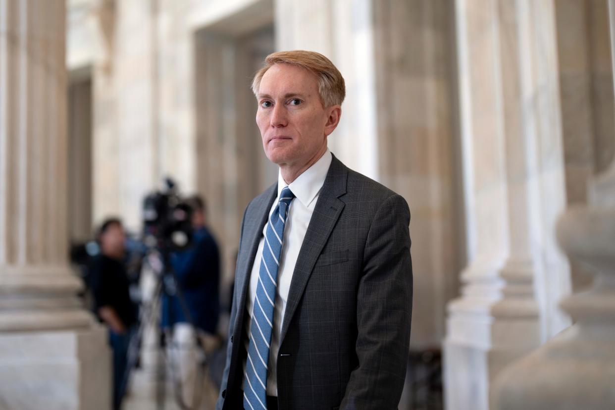 Sen. James Lankford, R-Okla., the lead GOP negotiator on the Senate border and foreign aid package, does a TV news interview at the Capitol in Washington, Monday, Feb. 5, 2024.