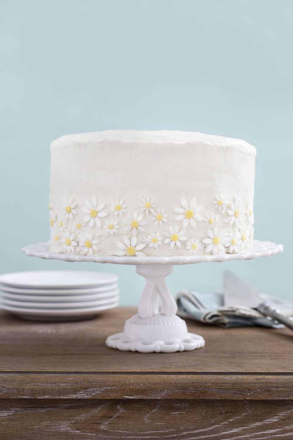 <p>Pre-made fondant daisies add a sweet touch to this crowd-pleasing favorite. </p><p><strong>Get the recipe at <a rel="nofollow noopener" href="https://www.countryliving.com/food-drinks/recipes/a35037/lemon-coconut-cake-with-mascarpone-frosting/" target="_blank" data-ylk="slk:Country Living.;elm:context_link;itc:0;sec:content-canvas" class="link ">Country Living.</a></strong></p>