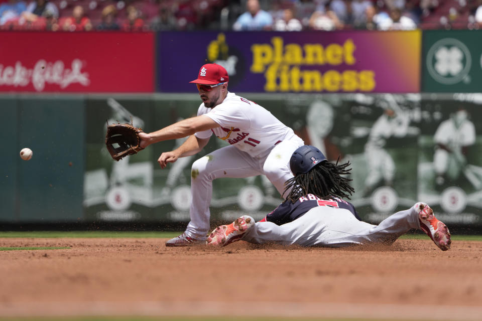 Washington Nationals' CJ Abrams is safe at second for a stolen base as St. Louis Cardinals shortstop Paul DeJong handles the throw during the fourth inning in the first game of a baseball doubleheader Saturday, July 15, 2023, in St. Louis. The contest was the resumption of a game started on Friday, but was suspended due to rain. (AP Photo/Jeff Roberson)