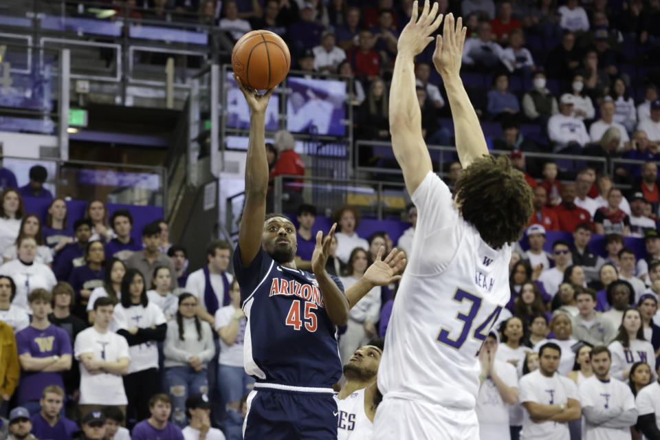 Arizona guard Cedric Henderson Jr. (45) shoots against Washington center Braxton Meah (34) during the first half of an NCAA college basketball game, Saturday, Jan. 28, 2023, in Seattle. (AP Photo/John Froschauer)